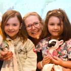 Wildlife Ambassador Award recipient Suzy Cato is flanked by Madeline Gallagher, 6, and Zoe...