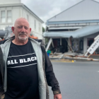 Martinborough building owner Bruce Sullivan in front of his damaged cafe. Photo: RNZ