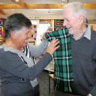 Balclutha Community Arts Centre secretary Mandy Newall arranges Graeme Booth with the first...