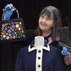 Tuhura Otago Museum honorary curator Dr Jane Malthus shows off a range of garments which will be...