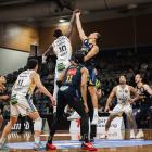 Otago Nuggets forward Jonathan Janssen (left) and Franklin Bulls forward David Okwera compete for...