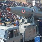 Indian soldiers stand beside a Pritthvi missile during a full dress rehearsal for an upcoming...