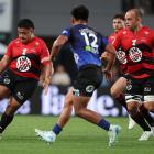 Ioane Moananu chips ahead during the round six Super Rugby Pacific match between the Blues and...