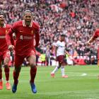 Virgil van Djik (centre) celebrates scoring Liverpool's winning goal, as Jarell Quansah (left)...