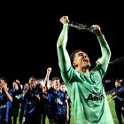 Auckland FC goalkeeper Alex Paulsen celebrates with the Premiers Plate at Go Media Stadium...