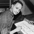 Cartoonist, author, playwright and Pulitzer Prize winner Jules Feiffer working on proof sheets...