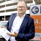 Tim Howe with his $566k bill. Photo: Geoff Sloan