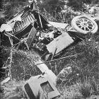 A wrecked Austin car at the foot of a cliff at Wharekuri, near Kurow on April 22, 1925.  — Otago...