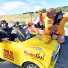 Trailing behind the pack north of Dunedin during the Pork Pie Charity Run are (from left) Dan...