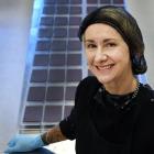 Ocho team member Wendy Batley shows off rows of freshly made Ocho craft chocolate squares. Photo:...