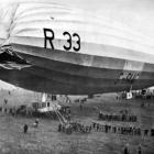 Ground crew haul ropes to secure British airship R33 at Pulham, Norfolk, following a damaging...