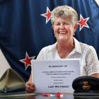 Waikouaiti RSA secretary Wendy MacLeod displays the book that lists every fallen soldier from the...