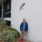 Artist Matt Willey takes a break after spending several hours painting a scout bee on the wall of...