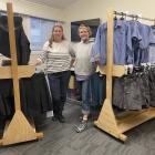 Jo Kitto (left) and volunteer Anna Brown in the uniform shop with brand-new clothing racks made...