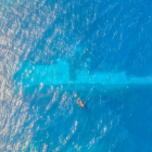 NZ Navy divers surveying the area around the sunken Manawanui warship in October last year. Photo...