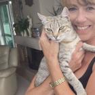 Deborah Coburn pictured with her cat, Lucy, who’s seemingly splitting her year with another local...