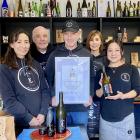 Celebrating their latest success, from left, are operations manager Yasuko Joll, director Richard...