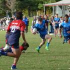 Wakatipu’s Conner Hamlin slips the Cromwell defence during the teams’ clash in Cromwell last...