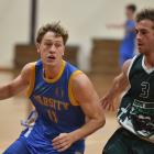 Varsity guard Jack Hollingworth tries to beat Bombers defender Ben Hoskin during the Dunedin men...