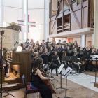 The Southern Youth Choir and Chamber Orchestra are directed by John Buchanan in a performance of...