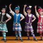 Highland dancers (from left) Eleanor McKay Vercoe, 10, Lara Mills, 8, Elise Cookson, 7, and Lucy...