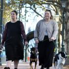 Katelyn Waugh (left), with Gary, and Sam Sinclair, with Lola, make the most of the new bylaw...