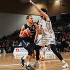 Jonathan Janssen looks for his entry to the post in the Otago Nuggets clash against the Hawke’s...