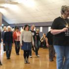 Diane Perkins teaches a group of Tussock Country festival-goers how to line dance at the Town ...
