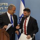 Israel's finance minister, Bezalel Smotrich, right, greets Israeli Prime Minister Benjamin...