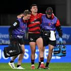 Taha Kemara leaves the field after sustaining an injury during the round 11 Super Rugby Pacific...