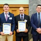Zack Armstrong (left) and Hernan Holliday show their awards presented by Associate Minister for...