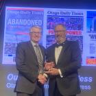 Otago Daily Times editor-in-chief Paul McIntyre (left) accepts the award for best editorial...