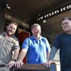 Outside the Law Courts Hotel are (from left) PKB builders contractor Paul Kirby and new owners...