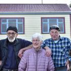 Mick Lewis (left), Mona Cromb and Keith Lewis in front of Lewis Cottage in Deborah Bay, which...
