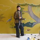 Portrait artist Māia Hetariki paints her laundry doors. Photo: Linda Robertson