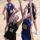 Physed A goal shoot Lucy Morrison battles for the ball with Southern Magpies goal keep Rebecca...