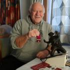 New Zealand Remembrance Army Waitaki regional co-ordinator Barry Gamble shows the miniature...