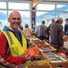 St Joseph’s School principal Alan Grant looks through the titles at the school’s annual book fair...