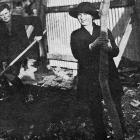 Master and Miss Ross, children of the chairman of the Exhibition company, plant the first tree...