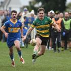Green Island winger Michael Manson toes the ball ahead during a Dunedin division 1 club game at...