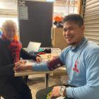 Workforce Central Dunedin contracted nurse Judy Currie runs a blood pressure check on worker...