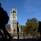 University of Otago students walk past the registry building. Photo: Gerard O'Brien