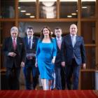 Finance Minister Nicola Willis (centre) on Budget Day wearing a blue dress believed to be from...
