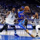 Oklahoma City Thunder guard Shai Gilgeous-Alexander drives to the basket against the Minnesota...
