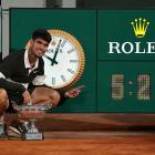 Carlos Alacaraz points to the match clock after playing — and winning — the longest final in...