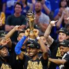 Oklahoma City Thunder players celebrate as Shai Gilgeous-Alexander lifts the Larry O'Brien...