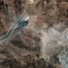 A satellite image shows airstrike craters on the perimeter of the Fordow Fuel Enrichment Facility...