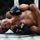 Alexandre Pantoja and Kai Kara-France (front) wrestle during their title fight, in Las Vegas,...