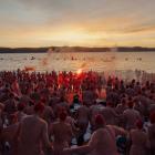 About 3000 people wearing nothing but bathing caps took an icy plunge in the River Derwent. Photo...