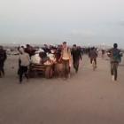 Palestinians carrying aid supplies in Rafah, in the southern Gaza Strip. PHOTO: REUTERS